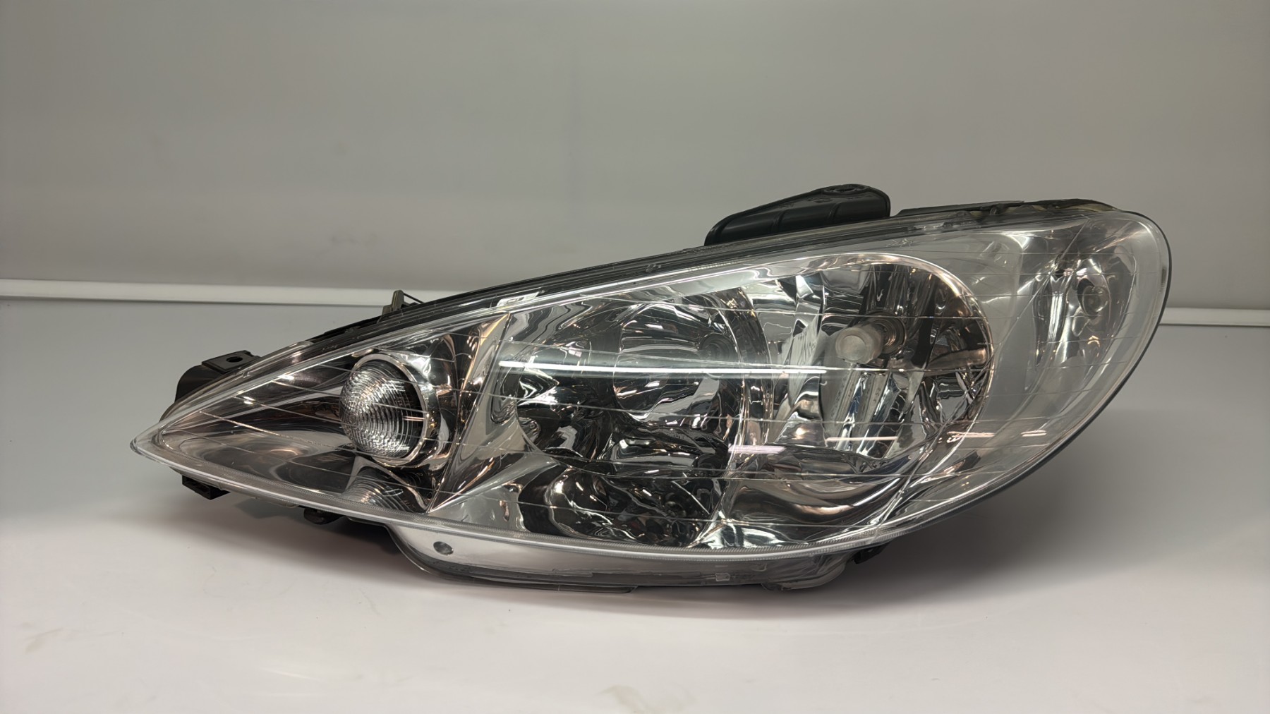 Optique avant principal gauche (feux)(phare) peugeot 206 phase 1