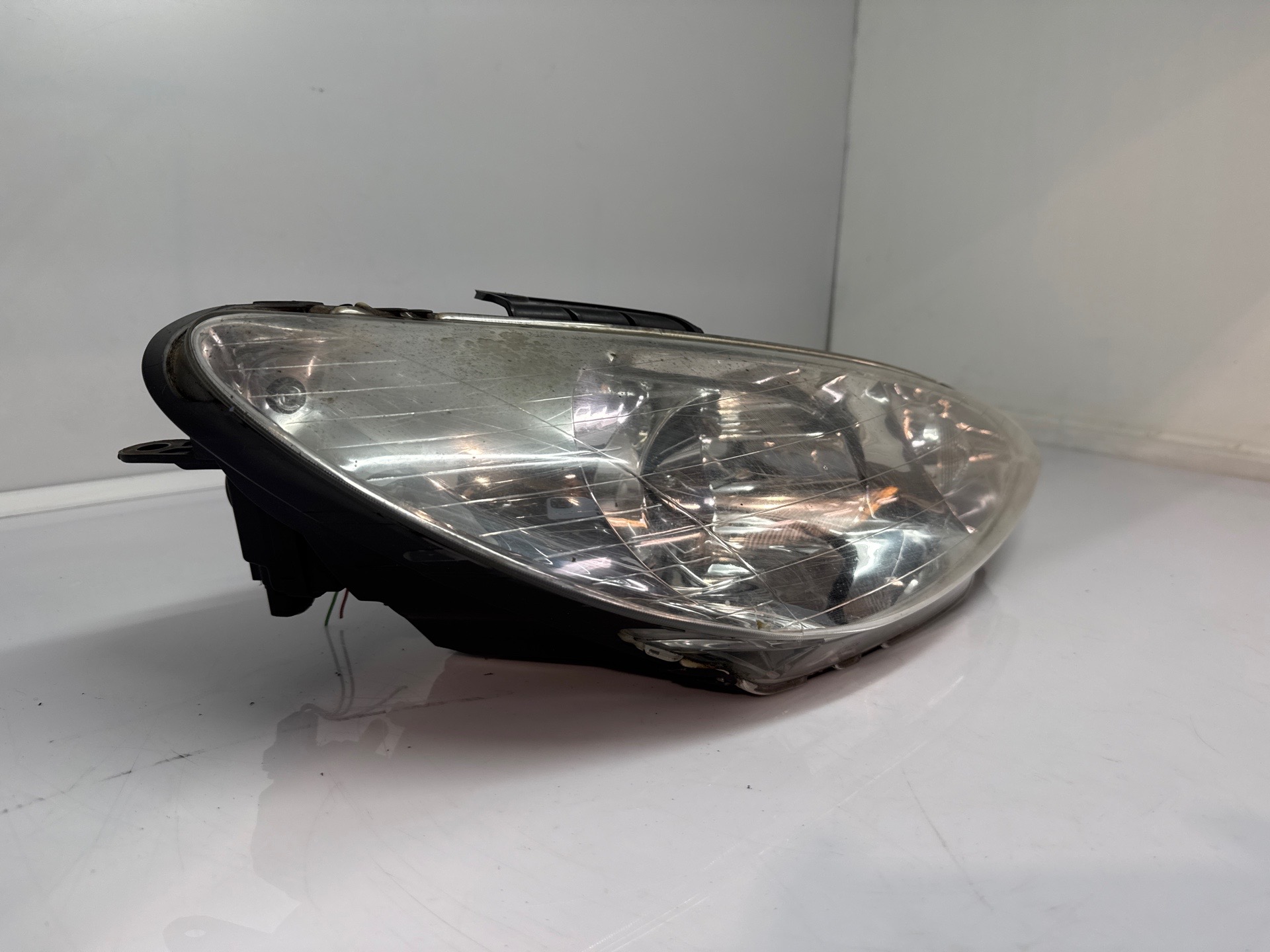 Optique avant principal gauche (feux)(phare) peugeot 206 phase 2